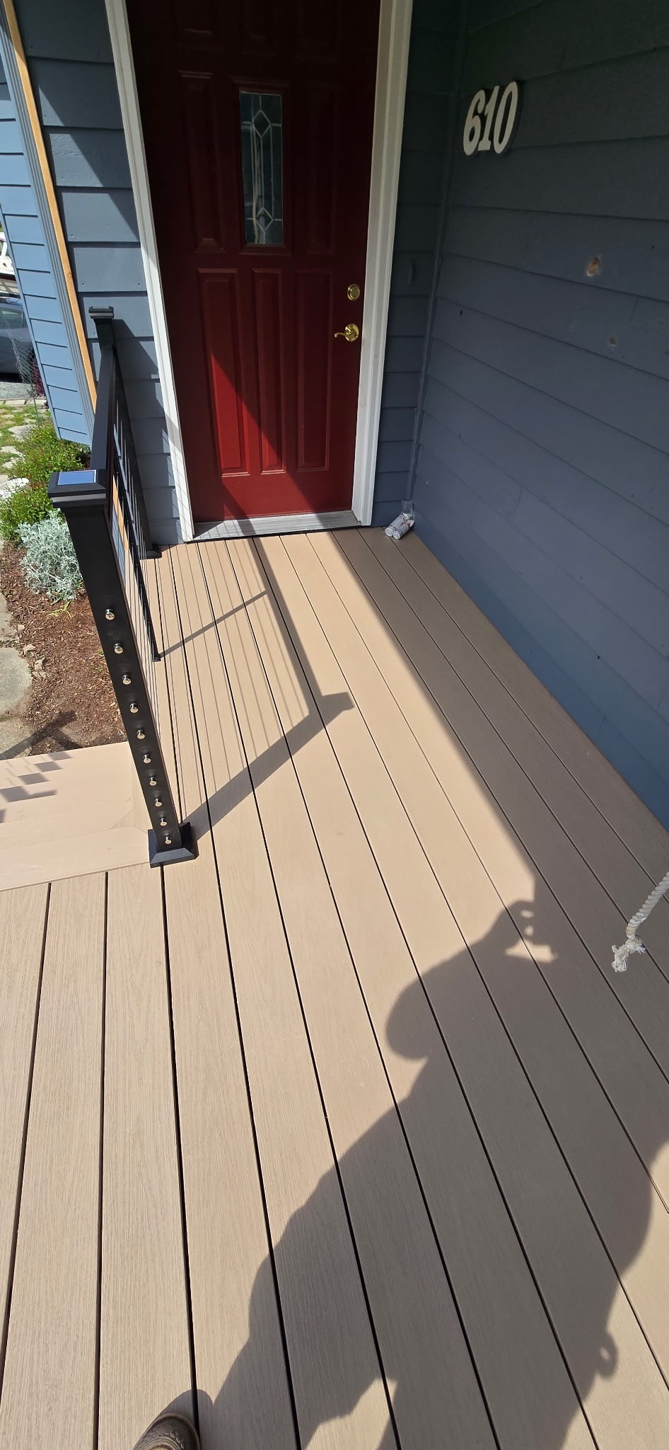 Composite porch deck boards installed at front entry